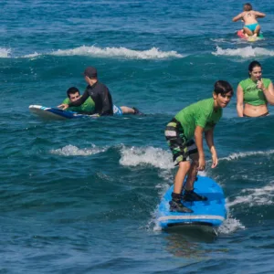 Two students receiving semi-private surf instruction