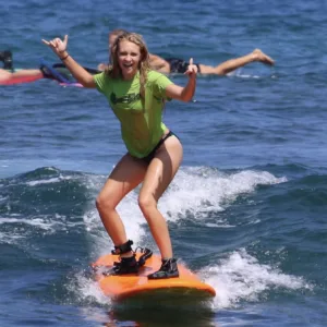 Individual receiving one-on-one private surf coaching