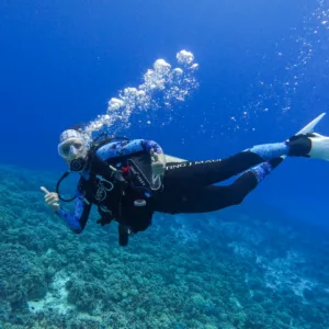 Divers exploring Molokini Crater on two-tank dive trip