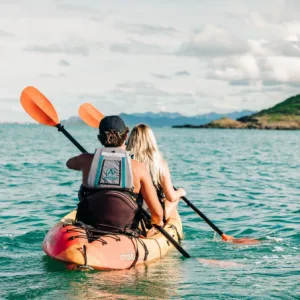 Kayaking near Chinaman's Hat island in calm ocean waters