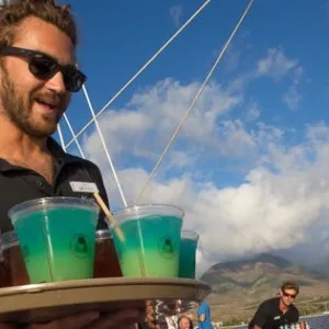 Guests enjoying a sunset cocktail cruise in Ma'alaea harbor