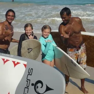 Instructor teaching stand up paddleboarding technique on calm water