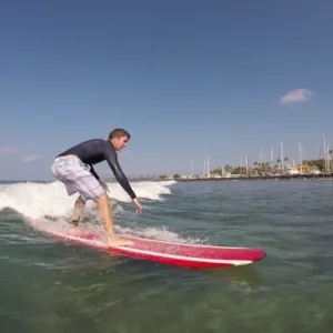 Surfer receiving detailed coaching during three-day private clinic