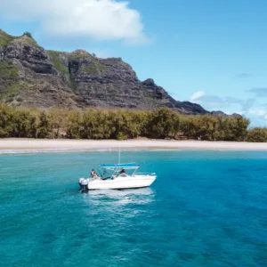 Private boat charter cruising Kauai’s clear waters