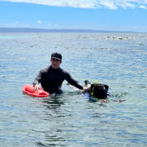 Non-swimmers learning snorkeling basics in calm waters