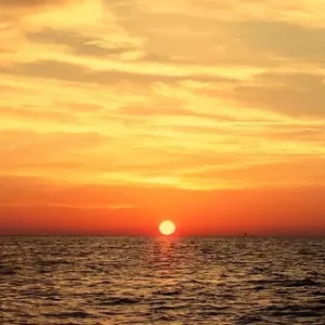 Scuba diving adventure during a vibrant sunset cruise