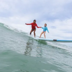 Surfer catching waves at Ala Moana beach in Oahu