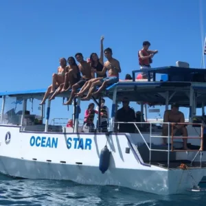 Couple snorkeling near coral reefs on private Waikiki cruise