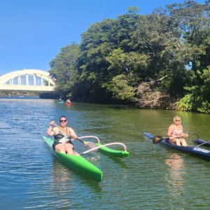 Outrigger canoe gliding across calm ocean waters