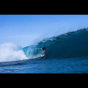 Experienced instructor guiding private advanced surf lesson