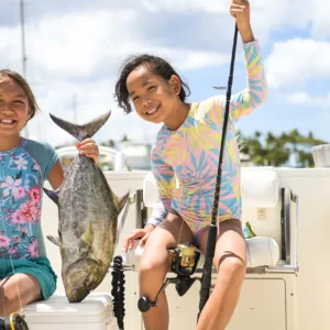 Fishing boat cruising near Ko Olina's tranquil shoreline