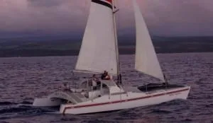 Boat cruising during golden sunset over ocean