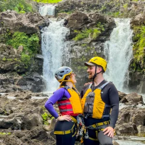 Descending the Umauma triple-tier waterfall by rappel