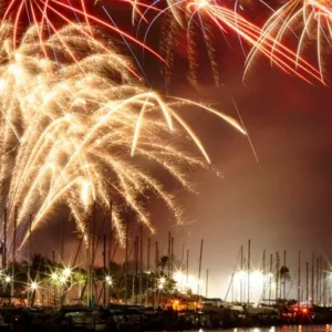 Couple watching fireworks during romantic sunset cruise in Waikiki