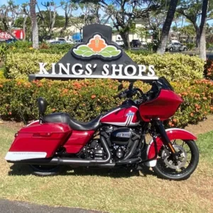 Red Road Glide motorcycle parked with ocean background