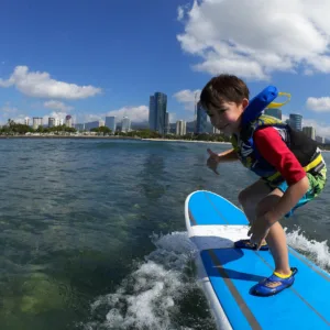 Surfboards lined up on Waikiki beach shore