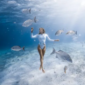 Photographer capturing underwater moments during scuba diving session