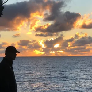 Steam rising from natural geothermal ponds in tropical area