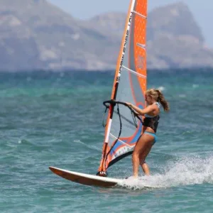 Windsurfers catching wind on island waters during course