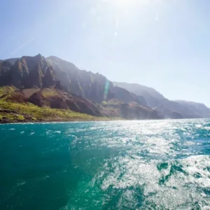 Scenic boat ride along Nā Pali Coast cliffs and sea
