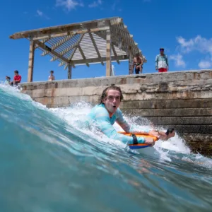 Private bodyboard lesson on a scenic island beach