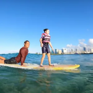 Child receiving a private bike lesson on a sunny island path
