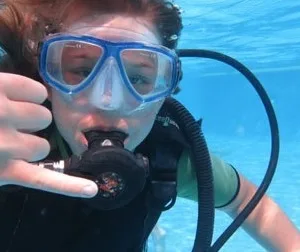 Beginner enjoying underwater views on introductory scuba dive