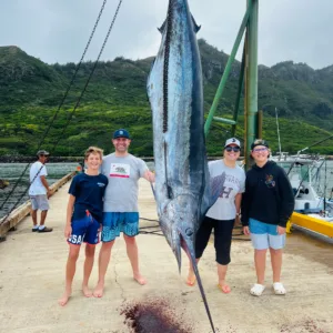 Luxury Bertram yacht cruising Kauai's ocean waters