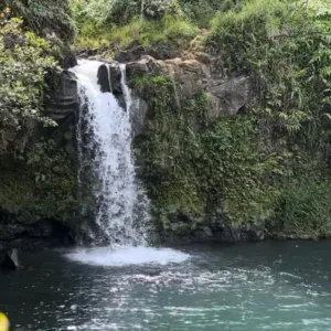 Jeep driving along Hana coast with ocean views