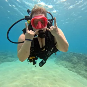 Certified diver exploring vibrant coral reef