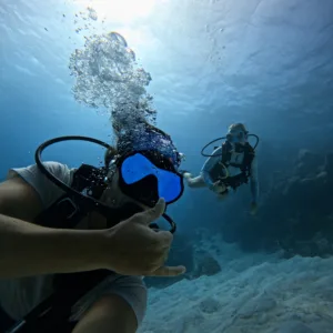 Private boat anchored near coral reefs for scuba diving