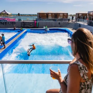 Surfer riding a giant wave near Waikiki shore