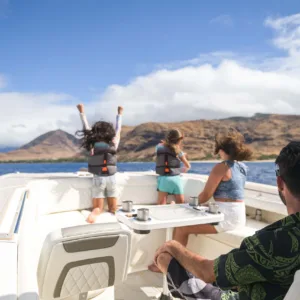 Group snorkeling adventure with whales nearby