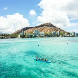 Participants learning traditional Hawaiian canoe surfing techniques