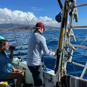 Fishing boat near shore during bottom fishing and trolling trip