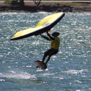 Foil boarding over waves with expert guidance