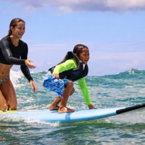 Tandem surf lesson for two on island waves