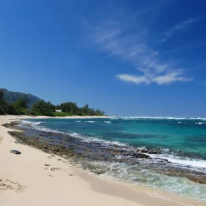 Tour group exploring North Shore coastline at sunset