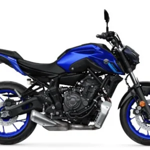 Yamaha MT-03 motorcycle parked along scenic highway