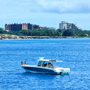 Luxury private charter boat docked at Ko Olina marina at sunset
