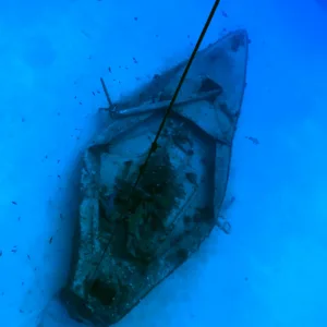 Diver exploring the sunken shipwreck at Kailua Bay