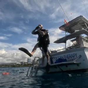 Scuba divers exploring vibrant reef during two tank dive