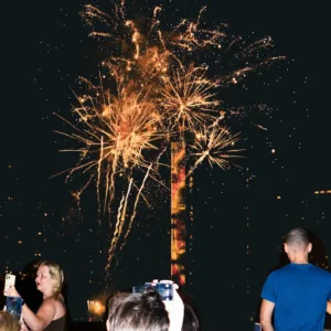 Nighttime fireworks over Waikiki beach during island celebration
