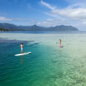 Adventurers snorkeling and splashing around Kaneohe sandbar