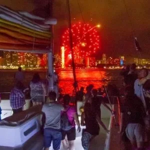 Evening cruise watching vibrant fireworks over water