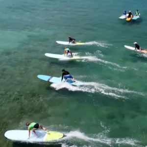 Join an open group surf lesson with friendly surfers