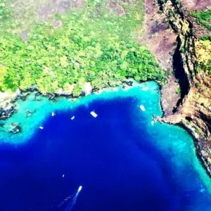 Kayakers paddling in clear waters of Kealakekua Bay