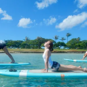 Instructor teaching stand up paddleboard techniques