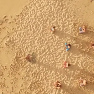 Participants practicing yoga after surfing on Kauai’s beaches