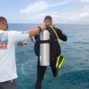 Beginner exploring underwater with scuba gear